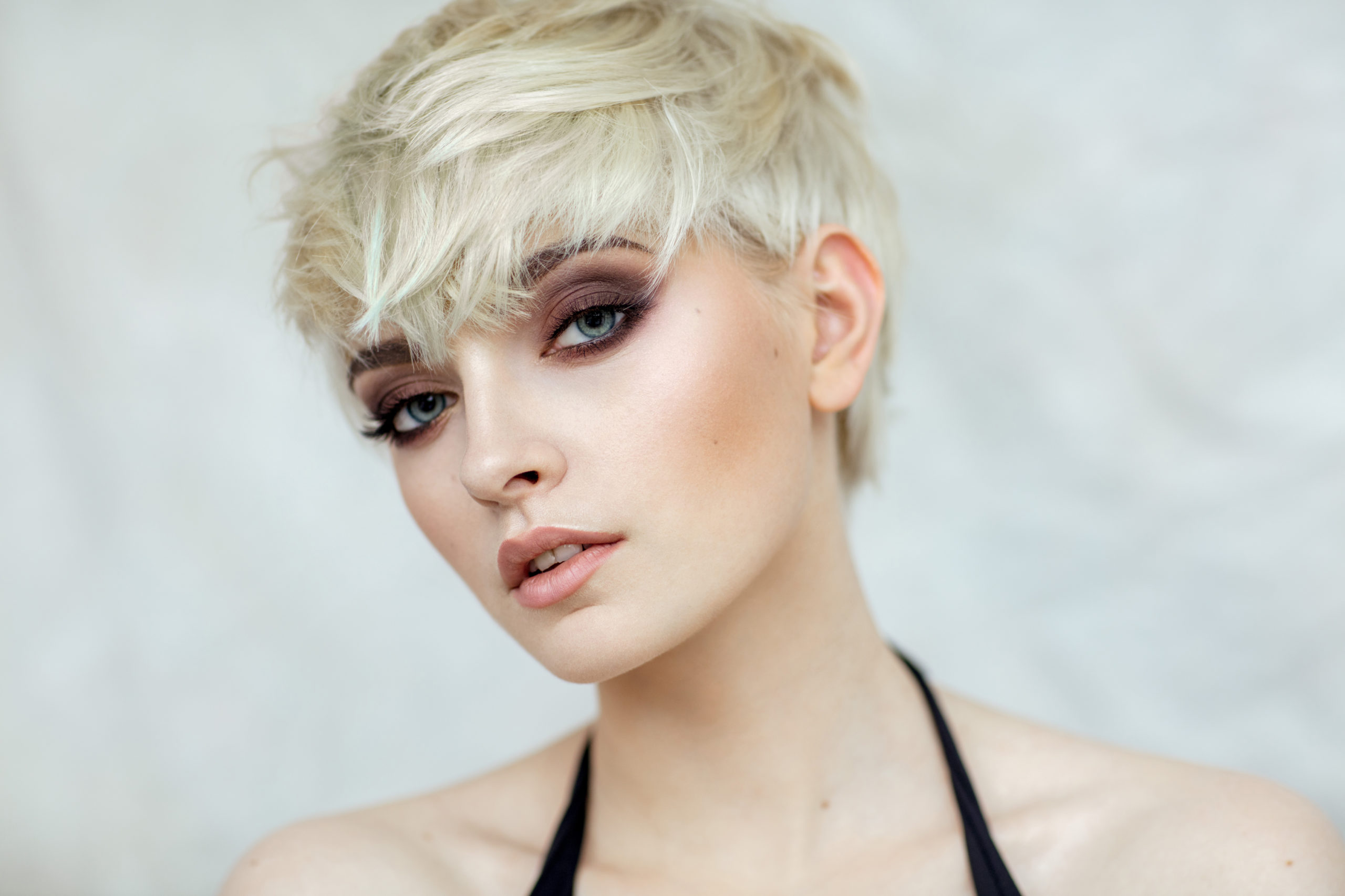 Beauty portrait of blond model in fashionable haircut
